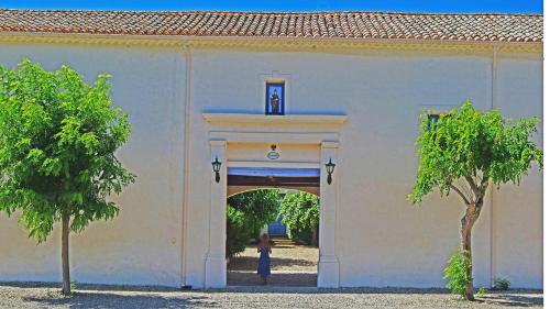 a person standing in an archway in a building at Domaine Saint Ferreol in Nizas