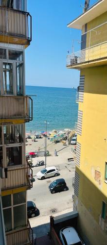 a view of a beach with cars parked in a parking lot at BluMare ArtHouse in Salerno