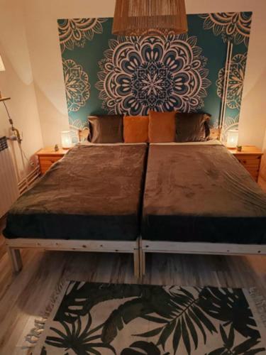 a bedroom with a bed with a floral wall at Inner Harmony Garden in Kanjiža