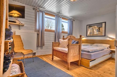 a bedroom with a bed and a desk and a chair at Grashöfle in Höhenbrunn