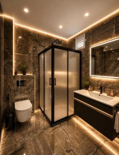 a bathroom with a shower and a toilet and a sink at Kumkapı Hotel - Special Category in Istanbul