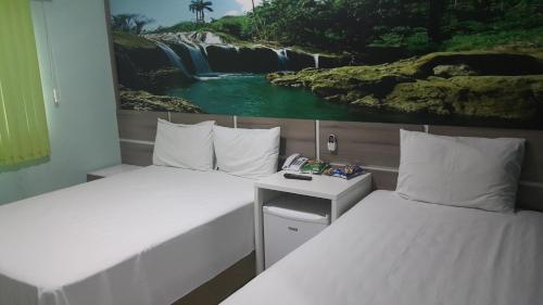 Ένα ή περισσότερα κρεβάτια σε δωμάτιο στο Forest Hotel
