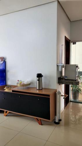 a kitchen with a counter top with a coffee pot on it at Hotel Goiamat in Querencia