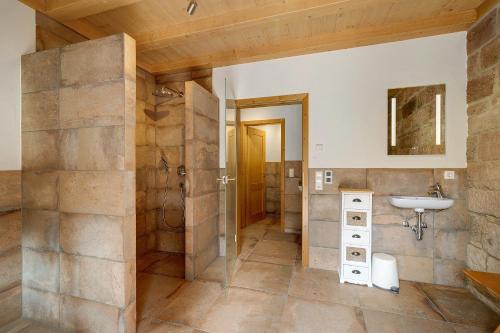 a bathroom with a sink and a mirror at Übernachtungsfaß in Alpirsbach
