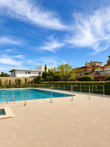 Bright apartment with balcony, pool, and tennis court