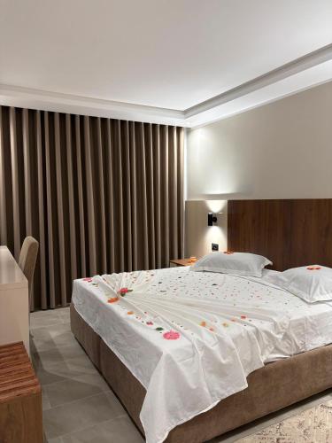 a bedroom with a large bed with christmas decorations on it at Hôtel Passage in Tunis