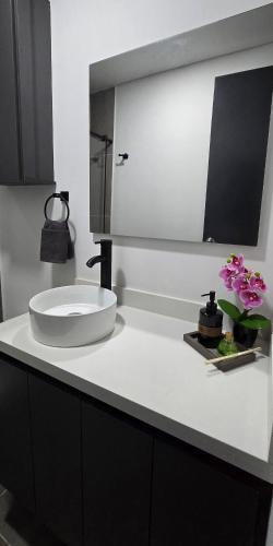 a bathroom counter with a sink and a mirror at apartamento tipo loft en sabaneta in Sabaneta