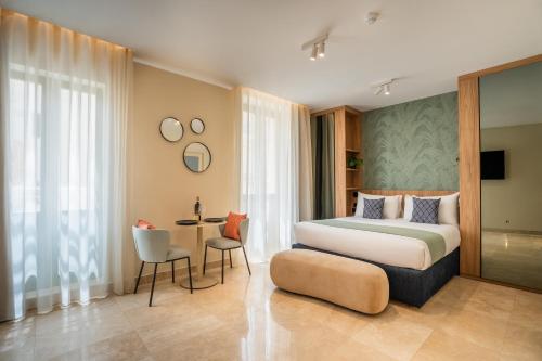 a hotel room with a bed and a table at The Three Doors in St. Julianʼs
