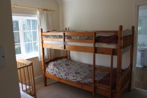 A bunk bed or bunk beds in a room at The Manor House