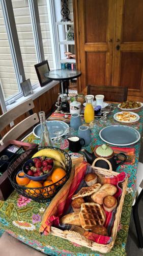 a table with a bunch of food on it at Gîte du Lac-à-la-Loutre - B&B in Huberdeau