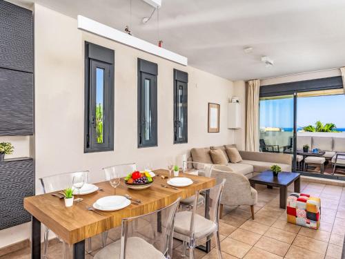 a dining room with a table and chairs at Apartment Alamar by Interhome in La Cala de Mijas