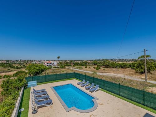 an overhead view of a swimming pool with lounge chairs at Holiday Home Casa do Sol by Interhome in Patroves