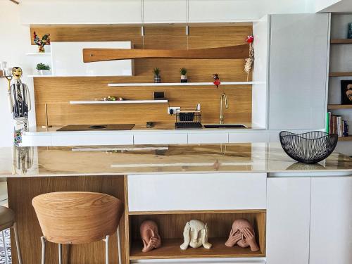 a kitchen with a counter with a sink at Apartment New Beach-1 by Interhome in Roquebrune-Cap-Martin