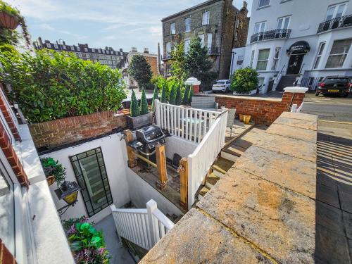 a building with a camera on the side of it at St Augustine's Stays - Stone Bay in Broadstairs
