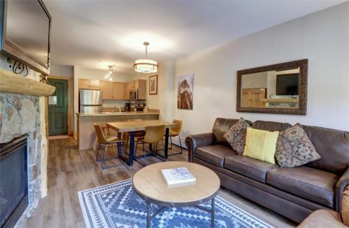 a living room with a couch and a table at CS221 Copper Springs in Copper Mountain