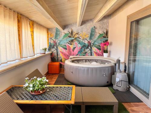 a bathroom with a large tub on a balcony at Casa Costanza 25 in San Cipirello