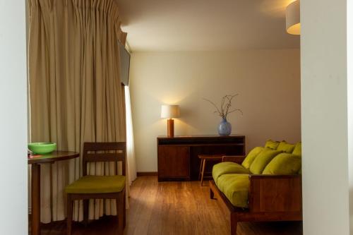 a living room with a couch and a table at Hotel The Exchange in Amsterdam
