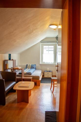 a living room with a couch and a table at Bockwirt in Schladming