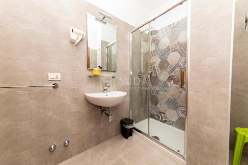 a bathroom with a shower and a sink at Giorni Salentini in Torre Lapillo