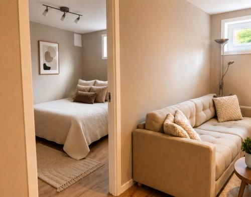 a living room with a couch and a bed at Leilighet Preikestolen in Strand