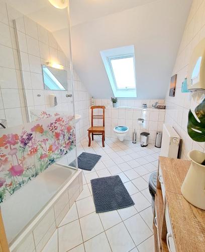 a bathroom with a shower and a tub and a toilet at Schullandheim Neukirch Lausitz in Meyershäuser
