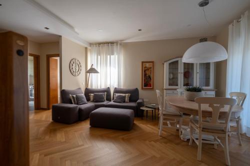 a living room with a couch and a table at ReDavid House Villa in Torre a Mare