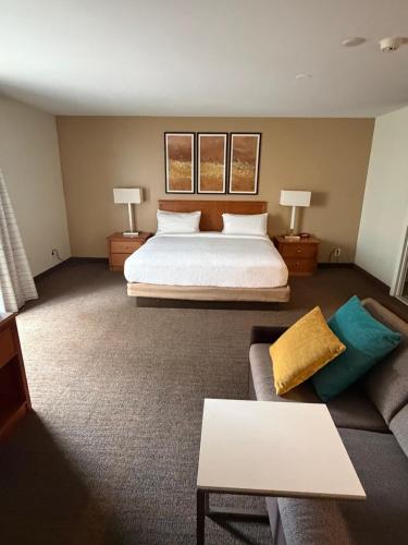 a hotel room with a bed and a couch at Residence Inn by Marriott Harrisburg Hershey in Harrisburg