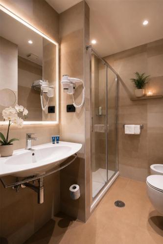 a bathroom with a sink and a shower at Best Western Hotel Rome Airport in Fiumicino