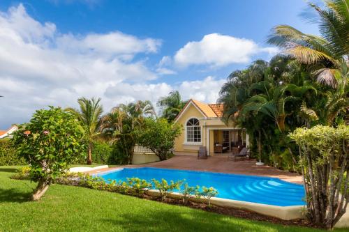 a house with a swimming pool in a yard at Hispaniola Residential - Villas & Apartments! in Sosúa