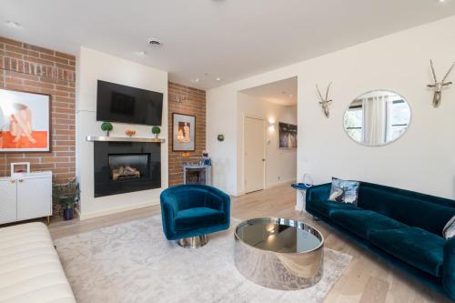 a living room with a couch and a fireplace at Leadville Penthouse #8 in Ketchum