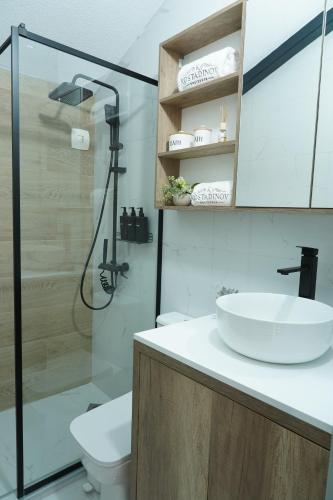 a bathroom with a sink and a shower at Kostadinov Residence in Demir Kapija
