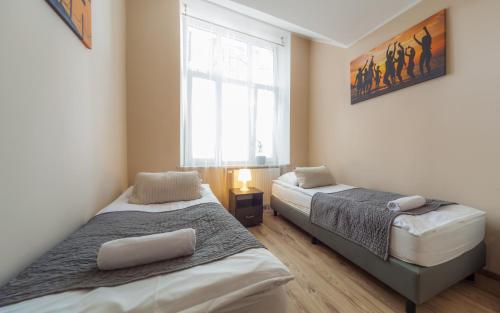 Cama o camas de una habitación en Central Sopot