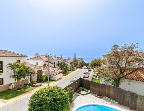 a view of a street in a residential neighborhood with houses at Rental Higueron Boutique Resort in Fuengirola