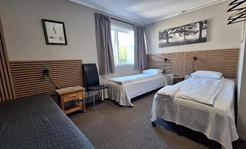 a hotel room with two beds and a window at Stavanger Bed & Breakfast in Stavanger