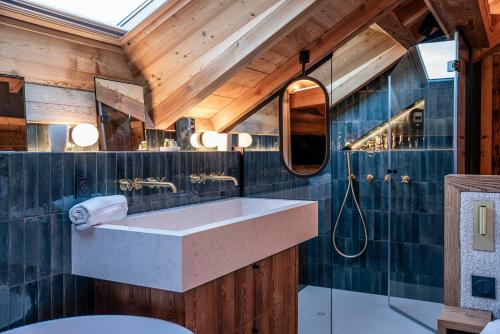 a bathroom with a sink and a shower at Galibier in Saint-Chaffrey