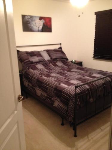 a bedroom with a bed in a room at Speedway Blvd Townhouse in Homestead
