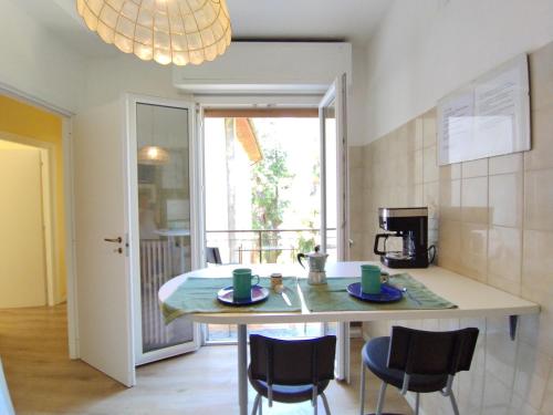 a kitchen with a table with two cups on it at casa marina in Pettenasco
