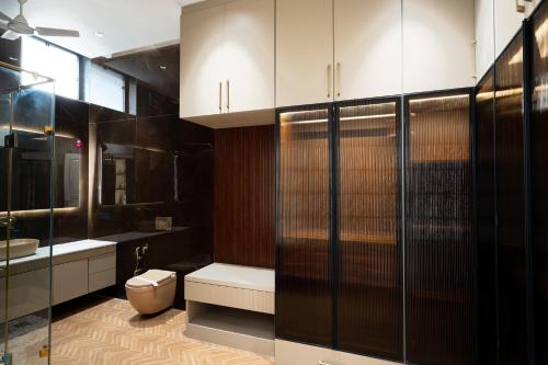 a bathroom with a toilet and a sink at Sukoon Luxury Stay in Amritsar