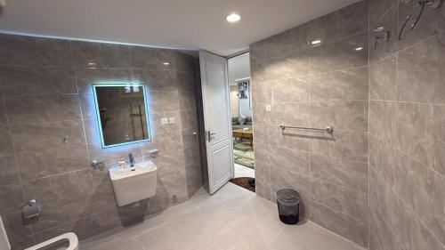 a bathroom with a sink and a shower at الشروق in Al Baha