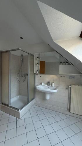 a bathroom with a shower and a sink at Private Home in Hamburg in Hamburg