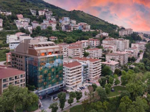 an aerial view of a city with buildings at Mövenpick Hotel & Thermal Spa Bursa in Bursa