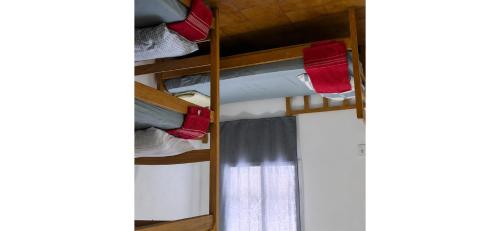 ajar view of a bunk bed in a room at HBTOUR Latin in Manaus