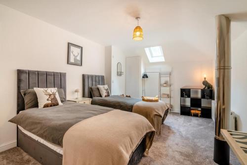 a bedroom with two beds in a room at 3 Bed in Blackburn oc-96386 in Blackburn