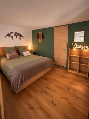 a bedroom with a bed with a sign on the wall at Studio élégant et indépendant Centre ville - Quartier facultés in Nantes