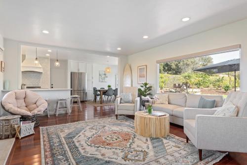 a living room with a couch and a table at Bella Luna in Carpinteria
