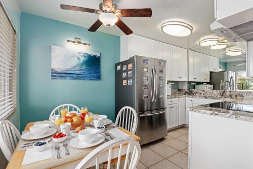 a kitchen with a table and a ceiling fan at Carpinteria Shores CS 103 in Carpinteria