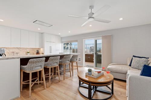 a kitchen and living room with a couch and a table at Carpinteria Shores CS 107 in Carpinteria