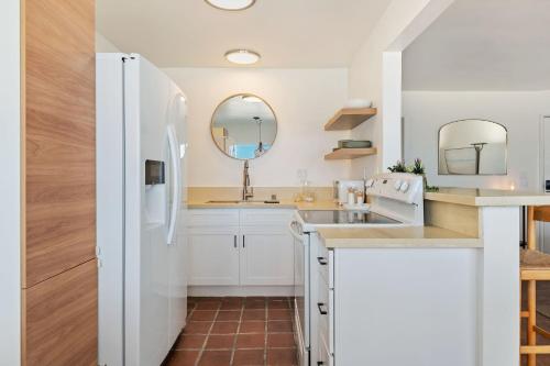 a kitchen with a sink and a refrigerator at Carpinteria Shores CS 210 in Carpinteria