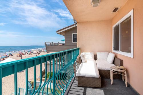 a balcony with a couch and a view of the beach at Carpinteria Shores CS 312 in Carpinteria