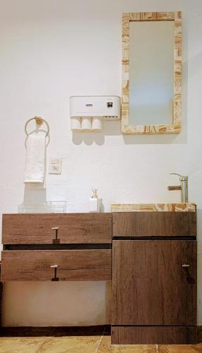 a bathroom with a sink and a mirror at Lake side Luxury Duplex ! in Jurica